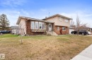 Split-level residence featuring a stone and stucco facade - 16424 106 Street, Edmonton, AB  - Outdoor 