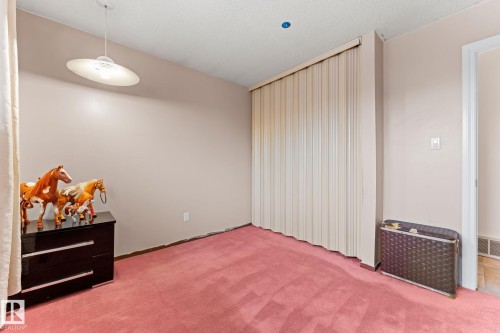 Room featuring plush pink carpeting and neutral wall paint - 16424 106 Street, Edmonton, AB - Indoor Photo Showing Other Room