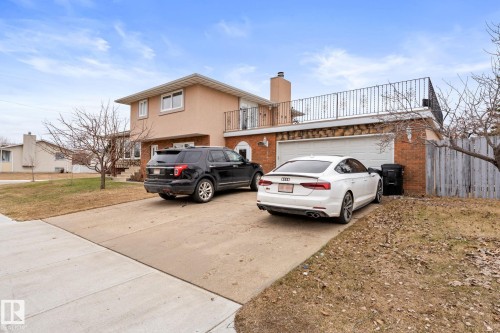 Split-level residence featuring a stucco and brick exterior - 16424 106 Street, Edmonton, AB - Outdoor