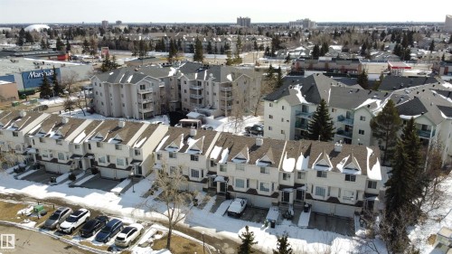The property features townhouses with attached garages, visible from an aerial perspective - 3 9703 174 Street, Edmonton, AB - Outdoor With View