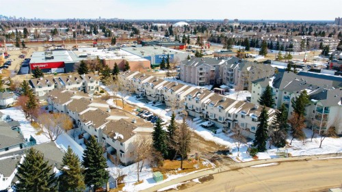 Aerial view showcasing townhouses and apartment buildings within a developed urban area - 3 9703 174 Street, Edmonton, AB - Outdoor With View