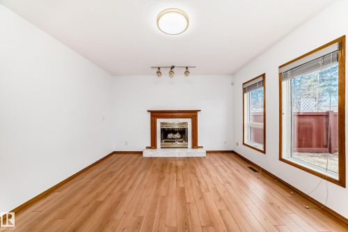 4631 43 Avenue, Edmonton, AB - Indoor Photo Showing Living Room With Fireplace