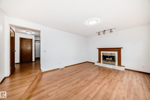 4631 43 Avenue, Edmonton, AB - Indoor Photo Showing Living Room With Fireplace