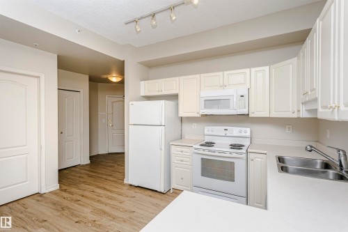 1701 10649 Saskatchewan Drive, Edmonton, AB - Indoor Photo Showing Kitchen With Double Sink