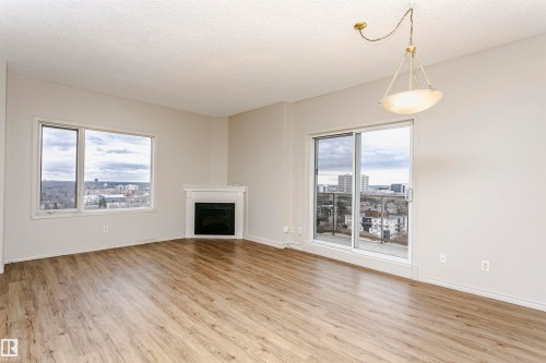1701 10649 Saskatchewan Drive, Edmonton, AB - Indoor Photo Showing Living Room With Fireplace