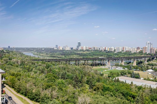 Expansive natural landscape featuring a river, dense tree canopy, and a prominent railway bridge - 1701 10649 Saskatchewan Drive, Edmonton, AB - Outdoor With View