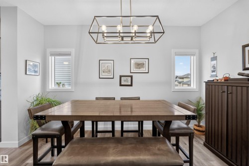 Dining area featuring wood-finish flooring and light gray walls - 53 Wingate Way, Fort Saskatchewan, AB - Indoor Photo Showing Dining Room