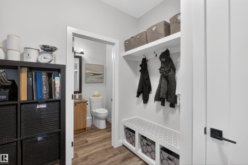 Built-in mudroom features an integrated bench, overhead shelving, and coat hooks - 53 Wingate Way, Fort Saskatchewan, AB - Indoor