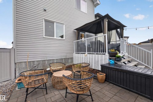 Backyard patio featuring paver stones and a multi-level deck - 53 Wingate Way, Fort Saskatchewan, AB - Outdoor With Deck Patio Veranda With Exterior