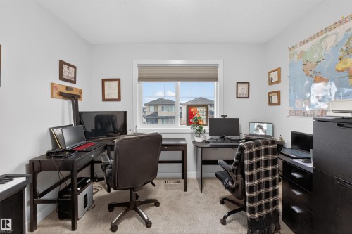 Bright room with a window featuring horizontal blinds - 53 Wingate Way, Fort Saskatchewan, AB - Indoor Photo Showing Office