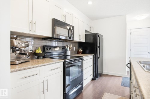 2061 Trumpeter Way, Edmonton, AB - Indoor Photo Showing Kitchen With Double Sink