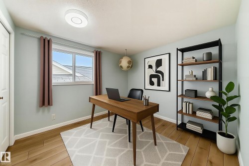 Well-appointed room featuring hardwood flooring, a window providing natural light, and a modern ceiling light fixture - 4224 30 Street, Edmonton, AB - Indoor Photo Showing Other Room