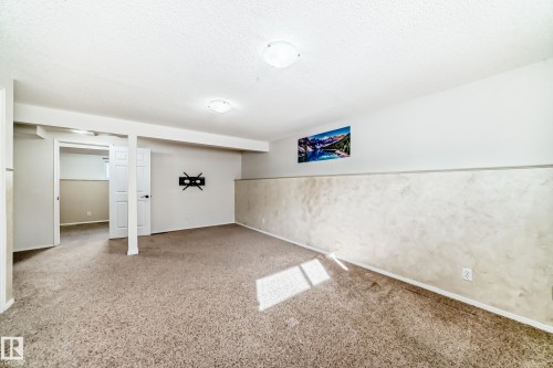 Spacious room featuring carpeting, white walls, and recessed lighting - 4224 30 Street, Edmonton, AB - Indoor Photo Showing Other Room