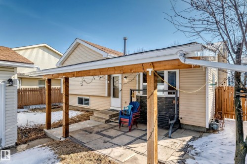 The property features a patio with a wooden overhang, providing an outdoor living space - 4224 30 Street, Edmonton, AB - Outdoor With Exterior