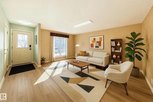 The property features a bright living area with light-toned flooring, expansive windows providing natural light, and warm wall colors - 4224 30 Street, Edmonton, AB - Indoor