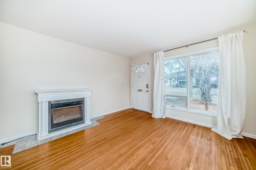 5204 112 Avenue, Edmonton, AB - Indoor Photo Showing Living Room With Fireplace