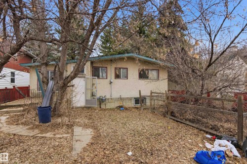 Single-story stucco exterior with multiple windows - 11211 77 Avenue, Edmonton, AB - Outdoor