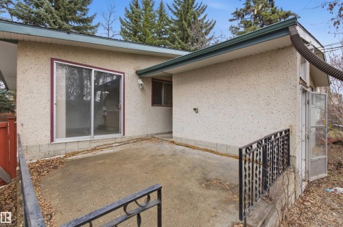 Concrete patio featuring wrought iron railings - 11211 77 Avenue, Edmonton, AB - Outdoor With Exterior
