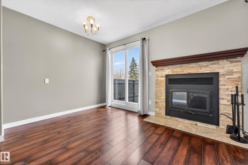 1556 69 Street, Edmonton, AB - Indoor Photo Showing Living Room With Fireplace