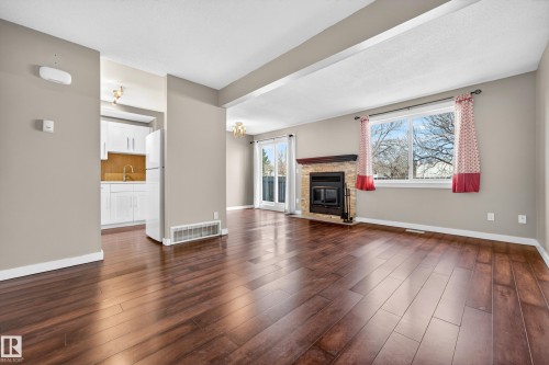 1556 69 Street, Edmonton, AB - Indoor Photo Showing Living Room With Fireplace