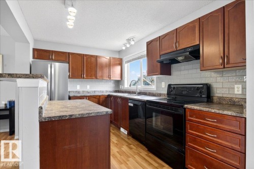 7410 14A Avenue, Edmonton, AB - Indoor Photo Showing Kitchen With Double Sink