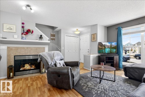 7410 14A Avenue, Edmonton, AB - Indoor Photo Showing Living Room With Fireplace