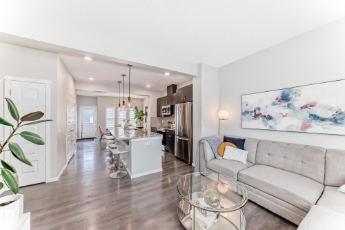 Open-concept living space featuring wood-finish flooring throughout - 3278 Cherry Crescent, Edmonton, AB - Indoor Photo Showing Living Room