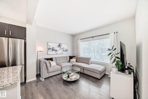 Open-concept living space with wood-finish flooring - 3278 Cherry Crescent, Edmonton, AB - Indoor Photo Showing Living Room