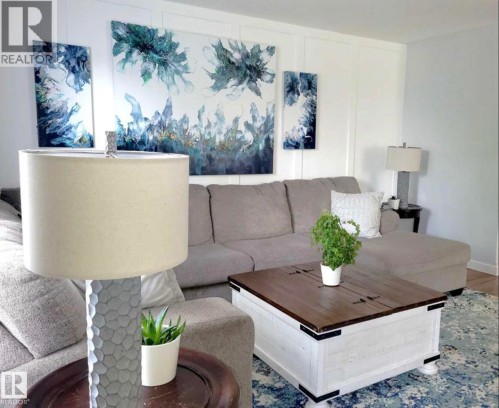 White board and batten accent wall - 144 Kirpatrick Way, Leduc, AB - Indoor Photo Showing Living Room