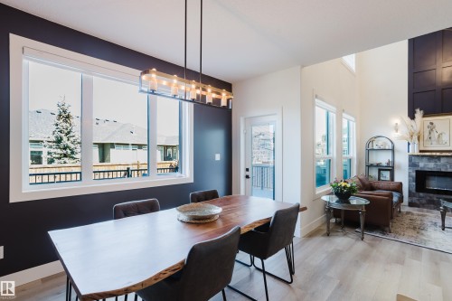 164 Hemingway Crescent, Spruce Grove, AB - Indoor Photo Showing Dining Room With Fireplace