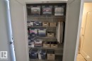 Built-in closet with wire shelving system and hanging rod - 81 446 Allard Blvd, Edmonton, AB  - Indoor Photo Showing Other Room 