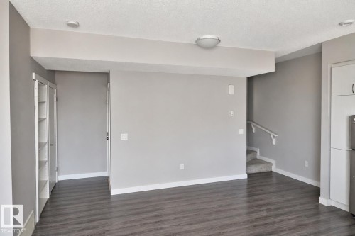 Spacious interior with durable wood-finish flooring - 81 446 Allard Blvd, Edmonton, AB - Indoor