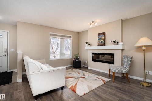 3199 Carpenter Landing Landing, Edmonton, AB - Indoor Photo Showing Living Room With Fireplace