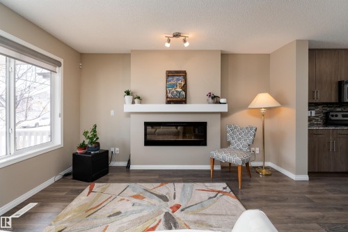 3199 Carpenter Landing Landing, Edmonton, AB - Indoor Photo Showing Living Room With Fireplace