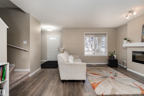 3199 Carpenter Landing Landing, Edmonton, AB - Indoor Photo Showing Living Room With Fireplace