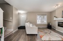 3199 Carpenter Landing Landing, Edmonton, AB  - Indoor Photo Showing Living Room With Fireplace 