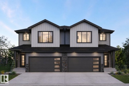 Modern duplex featuring a dark shingle roof, two single-car garages with frosted panel inserts, light and dark gray siding, and stone accents - 8538 223A Street Nw, Edmonton, AB - Outdoor With Facade