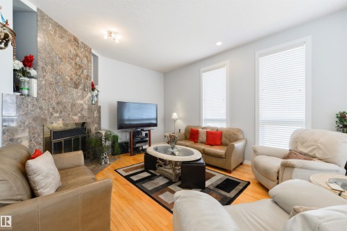 445 Whiston Way, Edmonton, AB - Indoor Photo Showing Living Room With Fireplace