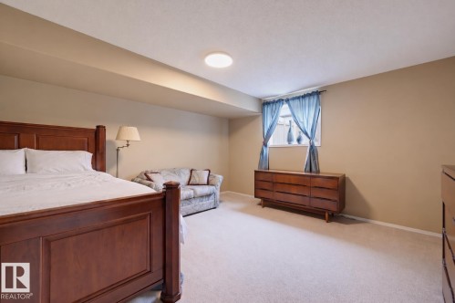Neutral-toned walls complement the light-colored carpeting - 21 Escada Close, St. Albert, AB - Indoor Photo Showing Bedroom