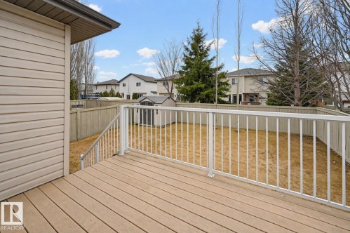 Spacious rear deck featuring wood-finish flooring and white railings - 21 Escada Close, St. Albert, AB - Outdoor With Deck Patio Veranda With Exterior