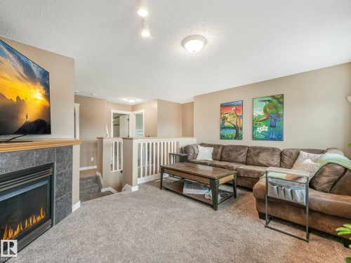 224 Hyndman Crescent, Edmonton, AB - Indoor Photo Showing Living Room With Fireplace