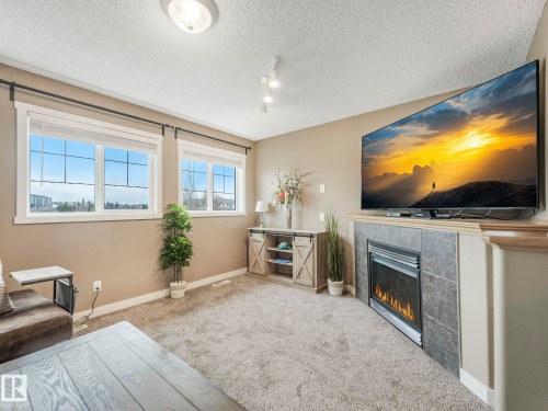 224 Hyndman Crescent, Edmonton, AB - Indoor Photo Showing Living Room With Fireplace