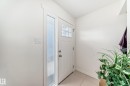 Entryway featuring a white paneled door with windowpanes and an opaque sidelight - 75 Amberly Court, Edmonton, AB  - Indoor Photo Showing Other Room 
