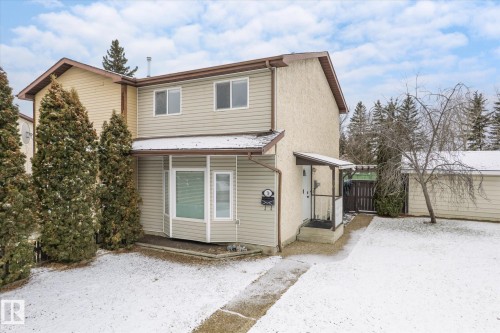 Two-story residence featuring light-colored siding and stucco exterior finishes - 70 Stirling Road, Edmonton, AB - Outdoor