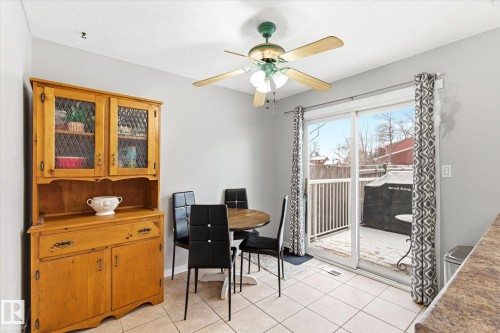 Dining area featuring light-toned tile flooring and a ceiling fan with integrated lighting - 70 Stirling Road, Edmonton, AB - Indoor Photo Showing Dining Room