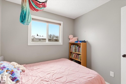 Room featuring neutral-toned walls and a single window with white trim - 70 Stirling Road, Edmonton, AB - Indoor Photo Showing Bedroom