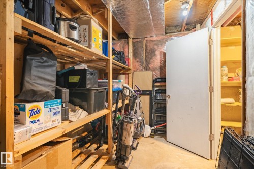 Unfinished basement area featuring exposed ceiling joists, insulation, and concrete flooring - 70 Stirling Road, Edmonton, AB - Indoor Photo Showing Basement