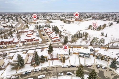 Aerial perspective showcasing the property's location within a residential area featuring snow-covered landscapes and established infrastructure - 70 Stirling Road, Edmonton, AB - Outdoor With View