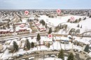 Aerial perspective showcasing the property's location within a residential area featuring snow-covered landscapes and established infrastructure - 70 Stirling Road, Edmonton, AB  - Outdoor With View 