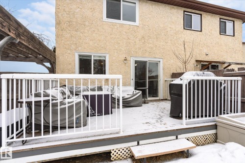 Expansive outdoor deck with white railings and a sliding glass door entry to the property - 70 Stirling Road, Edmonton, AB - Outdoor With Deck Patio Veranda With Exterior